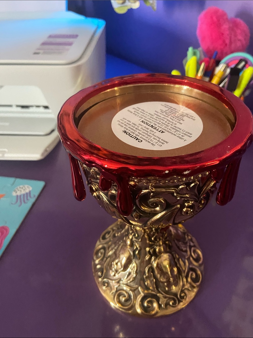 Ornate Gold Chalice Candle Holder with Red Drip Accent